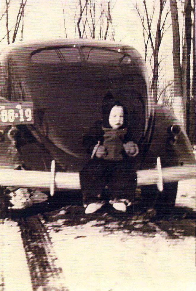 Ray Pratt as a child sitting on the back of his Little Ray on back of dad's Lincoln Zephyr V-12